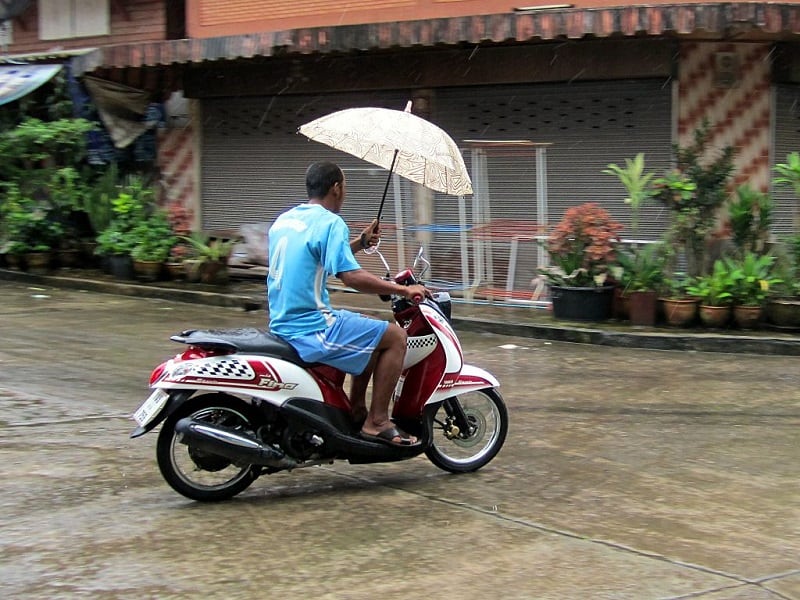 motorcycle scooter in the rain