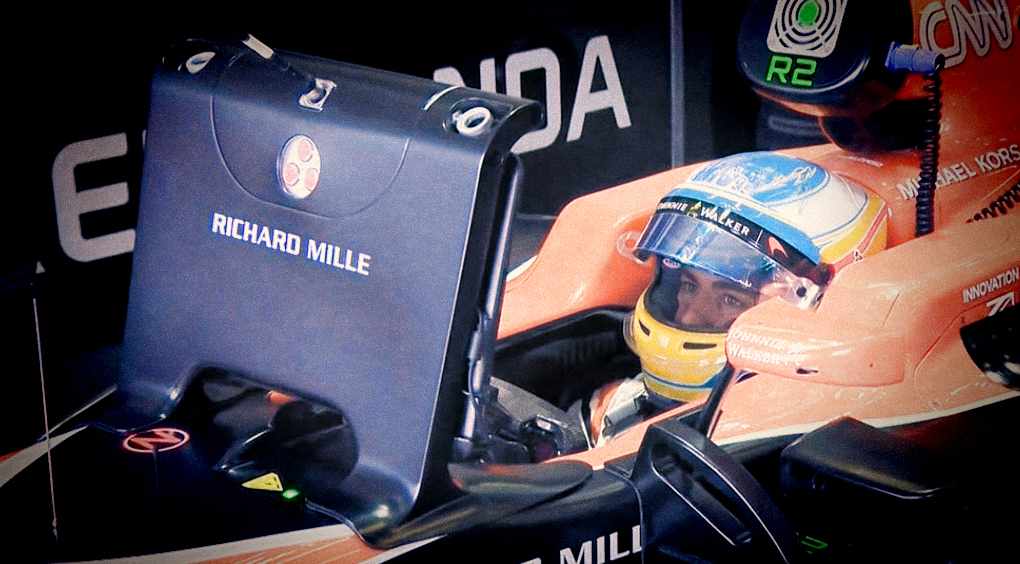 Fernando Alonso studying his monitor screen in his Mclaren 2017