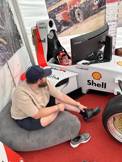 Hannah's photo of harry on the intentsgp f1 race simulator at the british f1 grand prix 2026