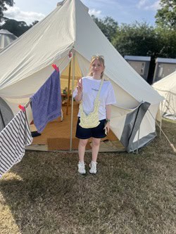 Lola outside her intentsgp glamping tent at the british f1 grand prix
